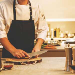 chef-in-restaurant-kitchen-cooking