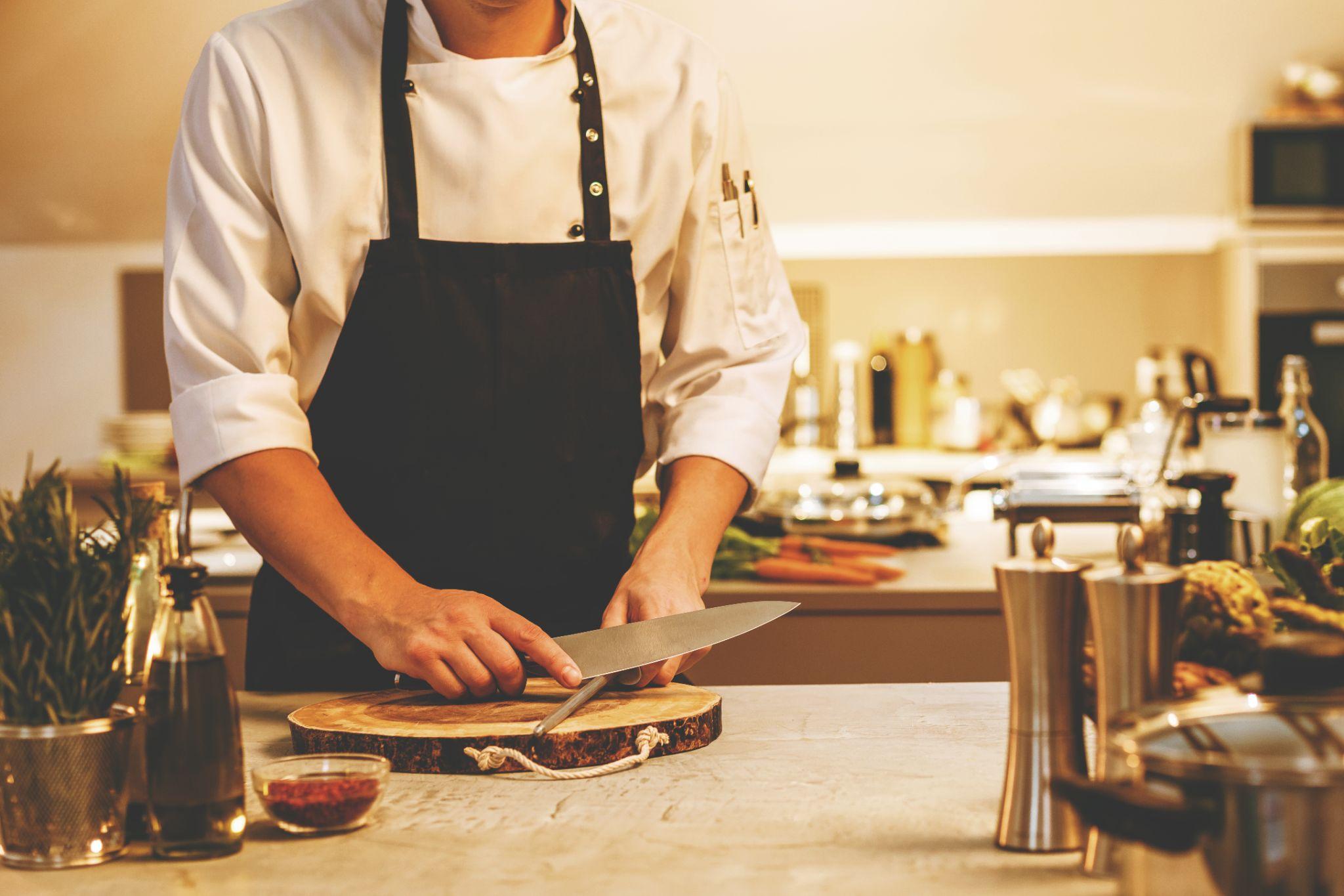 chef-in-restaurant-kitchen-cooking